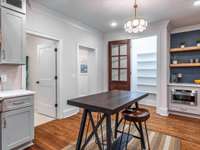 Spacious kitchen with Viking appliance package, marble countertops, custom vent hood, walk-in pantry, and coffee nook that will definitely spark a conversation!