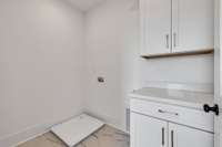 Laundry Room *Photo is of model home, actual features and finishes may vary.