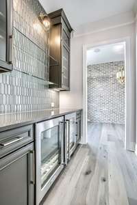 Step into the elegant butler's pantry, a culinary sanctuary designed to streamline your entertaining experience with effortless grace and style. TO BE BUILT - Buyer can customize ALL selections & upgrades.