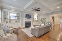 Beautiful coffered ceiling and built in shelves in the living room.