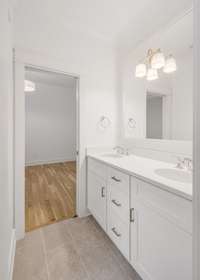 Jack and Jill bathroom with double vanities—ideal for easy sharing between bedrooms 2 and 3.