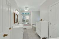 Master bathroom with two walk-in closets and water closet.