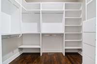 Spacious primary closet--one of 2 closets with drawer space. Both closets have sliding pocket doors