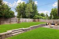 Fantastic patio for entertaining located directly off of the screened in porch. Virtually enhanced grass.