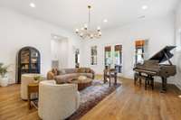 Oversized living room leads to the fully screened in back porch.