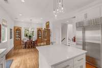 Breakfast room is adjacent to the kitchen. There is a powder room off of it.