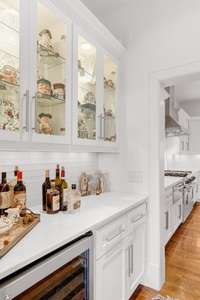 Butlers pantry between kitchen and dining room