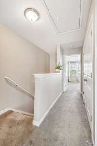 When you go upstairs, you have a large hallway that leads you to the bedrooms. The pull down attic located in this hallway also has room for storage.