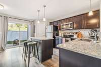 The kitchen is very spacious with beautiful granite countertops.