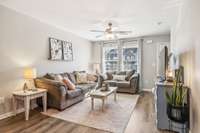 The living room also has a large window to let in natural light. What a beautiful view of other townhomes in the neighborhood.