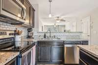 The cabinets are a beautiful wood with a dark stain finish.