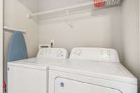 This laundry room is upstairs, conveniently located in between both bedrooms.