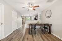 The dining room is large enough to have a table with 4 chairs.