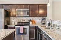 The backsplash is a small subway tile. It’s the perfect touch to add character to this beautiful modern kitchen.