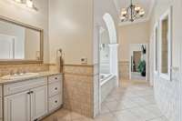This photo gives you another view of the Primary Bath Suite designed to pamper you with Luxury, Elegance, and Orderly Convenience.