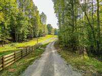 What a great driveway with endless fencing.