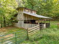 This is the Summer Barn which is about 1/2 way up the driveway. More than enough fenced & gated areas for your Horses, goats, cows or whatever you wish.