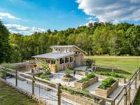Green house and garden area. Garden area has water inside and to each planting area. The greenhouse also is equipped with top temperature-controlled windows that open and shut depending on the temperature setting..