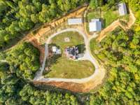 This compound sits in the middle of 168+ almost all wooded paradise.
