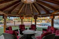 This 18x18 foot octagon shape gazebo has lots of outdoor lights, open skylight, paved flooring and great outdoor fire pit.