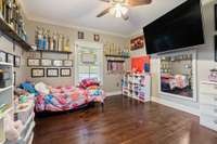 Bedroom 4 with solid wood flooring and oversized closet.