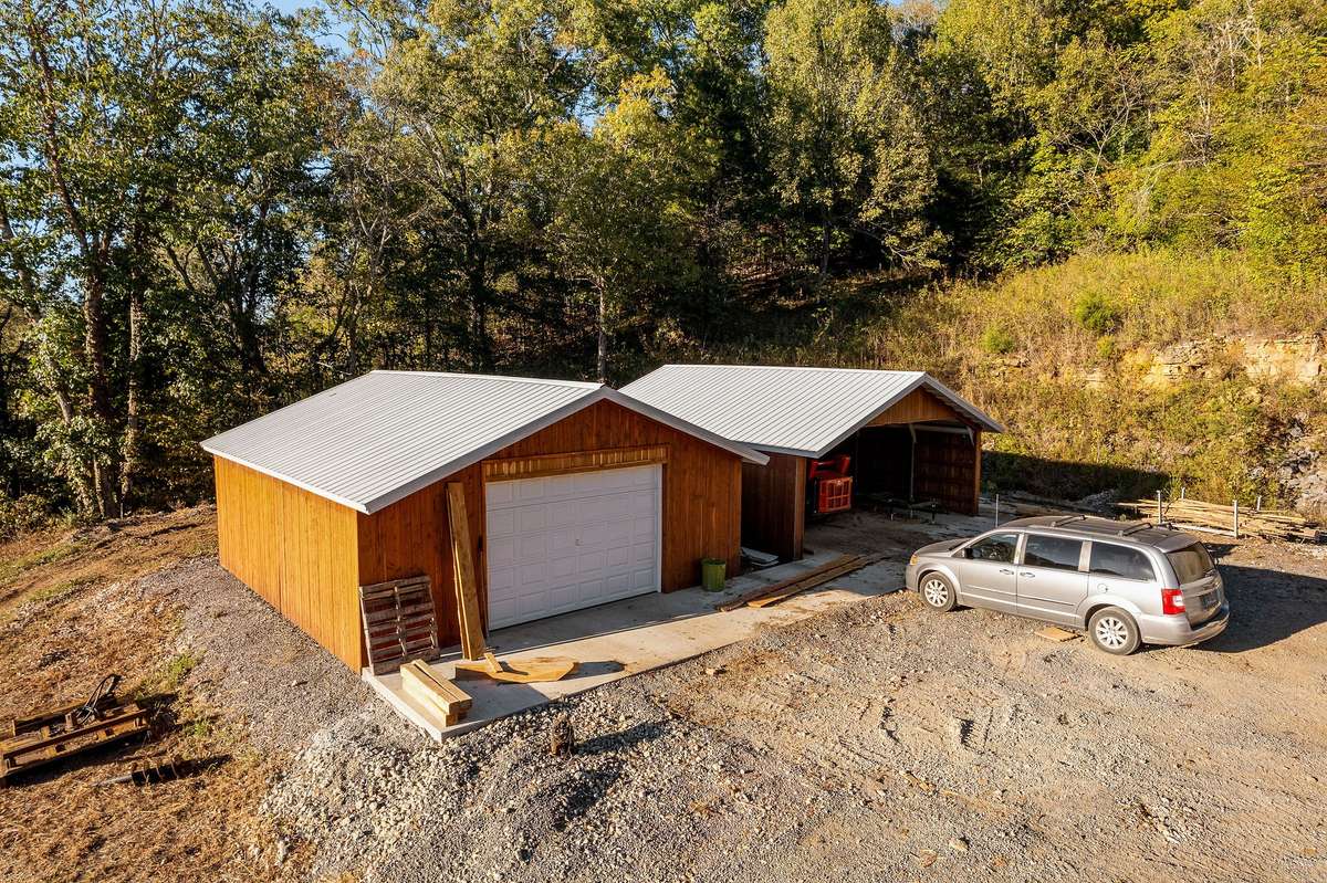 2 workshops that any owner will love, each shop is 600 sq ft, electric in place, concrete floors, cedar siding and metal roof, built in 2023
