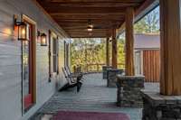 Enjoy this large extra wide covered front porch with stone/cedar post accents, cedar ceiling accents. Porch stretches the full width of home  and offers plenty of space for those rocking chairs.
