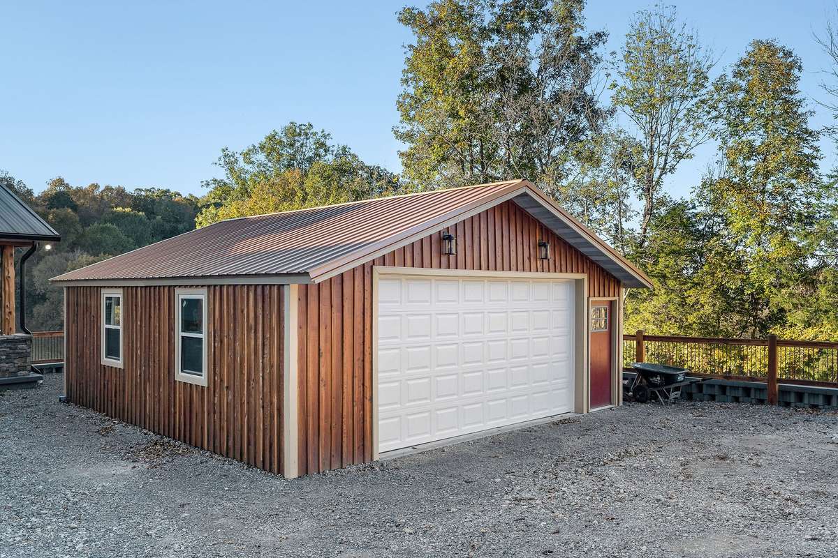 600 sq ft detached garage located close to home, garage door opener, double rear doors, concrete floor, metal roof and cedar siding describes this garage