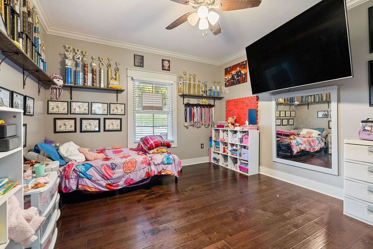 Bedroom 4 with solid wood flooring and oversized closet.