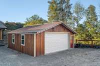 600 sq ft detached garage located close to home, garage door opener, double rear doors, concrete floor, metal roof and cedar siding describes this garage