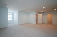 This huge space upstairs, can be used as third bedroom.  There are 3 huge closets for extra storage.