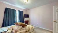 The fourth bedroom features large windows for ample natural light and carpet flooring. 1334 Nicole Ln  La Vergne, TN 37086