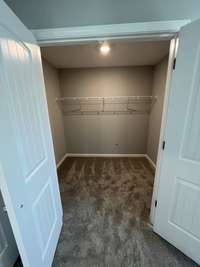 Bedroom #3 Closet  *Photo is from a completed unit of the floor plan. Options and selections may vary in actually property.