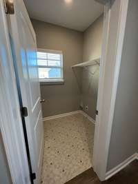 Laundry Room.  *Photo is from a completed unit of the floor plan. Options and selections may vary in actually property.