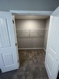 Bedroom #2 Closet  *Photo is from a completed unit of the floor plan. Options and selections may vary in actually property.