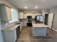 Kitchen  *Photo is from a completed unit of the floor plan. Options and selections may vary in actually property.