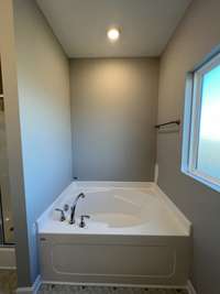 Primary Bath.  *Photo is from a completed unit of the floor plan. Options and selections may vary in actually property.