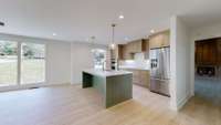 View of Kitchen & entryway to the Den.