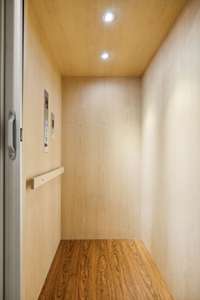 Enjoy a whisper smooth ride in your own private elevator located just off of the entry foyer featuring rich wood paneling and stainless steel with warm ambient lighting.