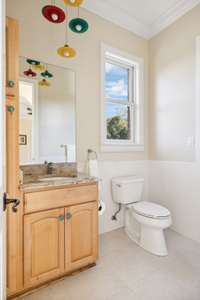The full bath is located just off of the back hall way and is perfect for rinsing off after a dip in the pool.