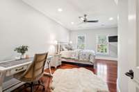 This upper level bedroom features Brazilian hardwood floors and private bath and walk in closet.