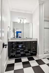 This bath features a walk in shower and serves bedroom three on the upper level.