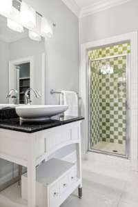 This private bath en-suite features a separate tub and shower with access to a large walk in closet. See media for more images of this space.