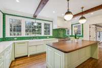 FRANKE Farmhouse Sink; Miele and Fisher & Paykel dishwashers; WOLF gas double oven with six burners, griddle & professional hood; WOLF convection microwave and WOLF Conventional Microwave; 72” Sub-Zero side-by-side; built in ice maker.