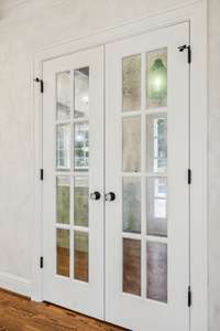 Pantry with smoked mirror rather than glass doors.