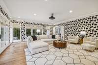 The Family Room, with a fun and frisky canine wall covering, separates the Kitchen from the Owner’s Suite.