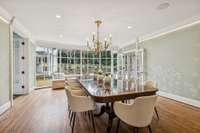 Formal Dining overlooks outdoor living and pool area.