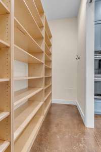 An abundance of pantry shelves, offering plenty of storage for dry goods, cookware, and kitchen essentials. The organized layout maximizes space, making it easy to access everything you need while keeping your kitchen tidy and efficient.