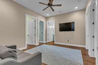 A versatile room, perfect for a media room since there are no windows when bedroom doors are closed. Centrally located with four bedrooms and a full bath branching off from each side.