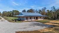 Fresh gravel/parking areas. Not a detail was missed to make this farmhouse functional & practical: 4 outdoor spigots for easy access to water plus plumbing has been stubbed at shop & also for addtl plumbing for future livestock needs, a pool etc.